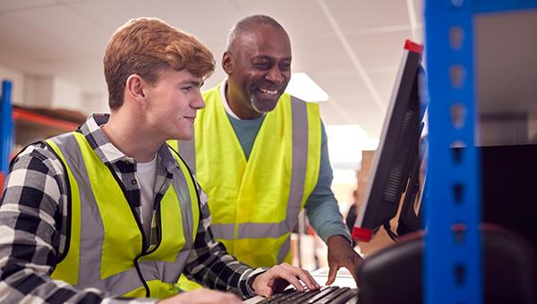 Apprentice looking over the shoulder of student