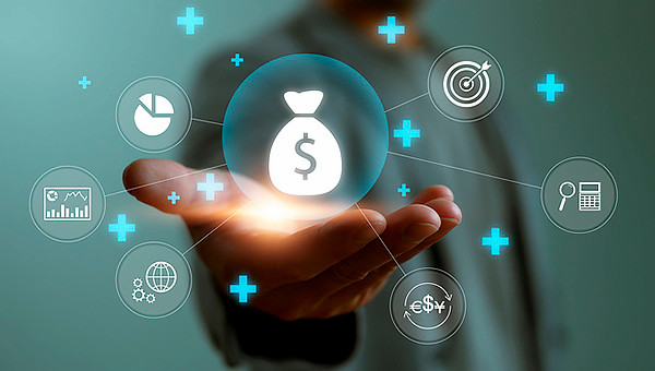 An outstretched hand, palm holding an image of a money bag at the center of a cluster diagram that connects to other icons related to charts, currency, and calculating