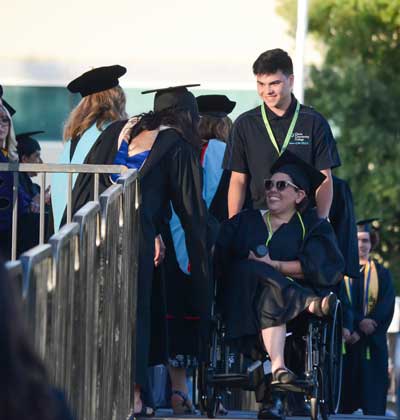 Two female students attending graduation