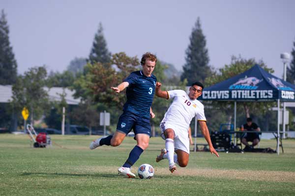 Clovis student coming in for the tackle in a game of soccer