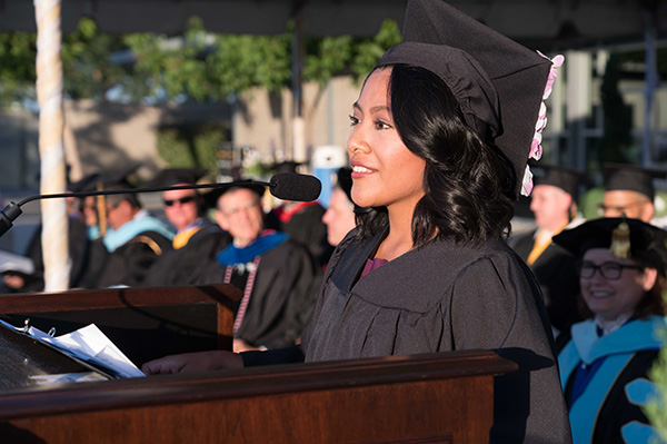 Madera graduating student speaking at podium.