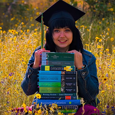 Madera Community College graduate with books