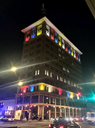 Fulton Office with red, blue, yellow, and white lights