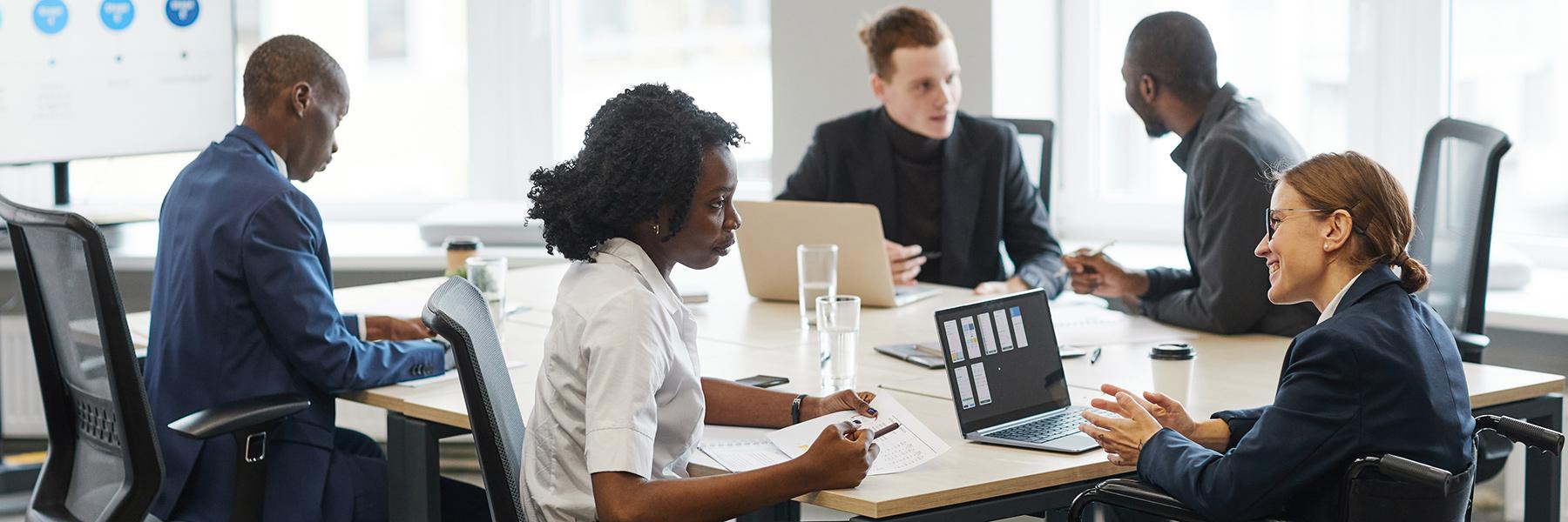 employees discussing business around a table