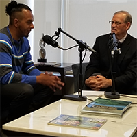 Dr. Paul Parnell talking with Stephen Kodur