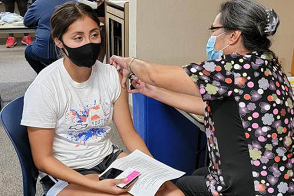 Student receiving COVID vaccination.